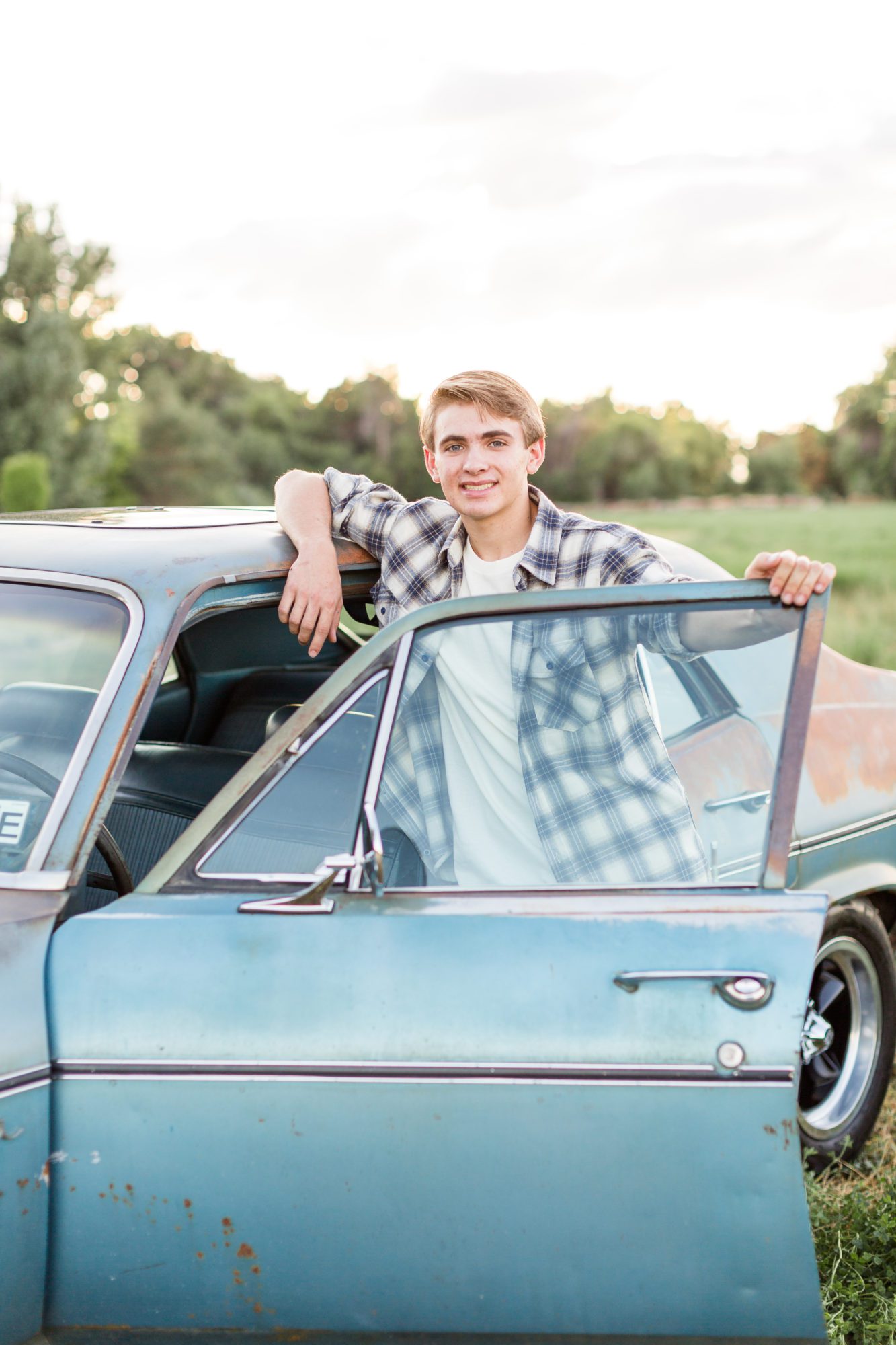 Guy's senior pictures with cars