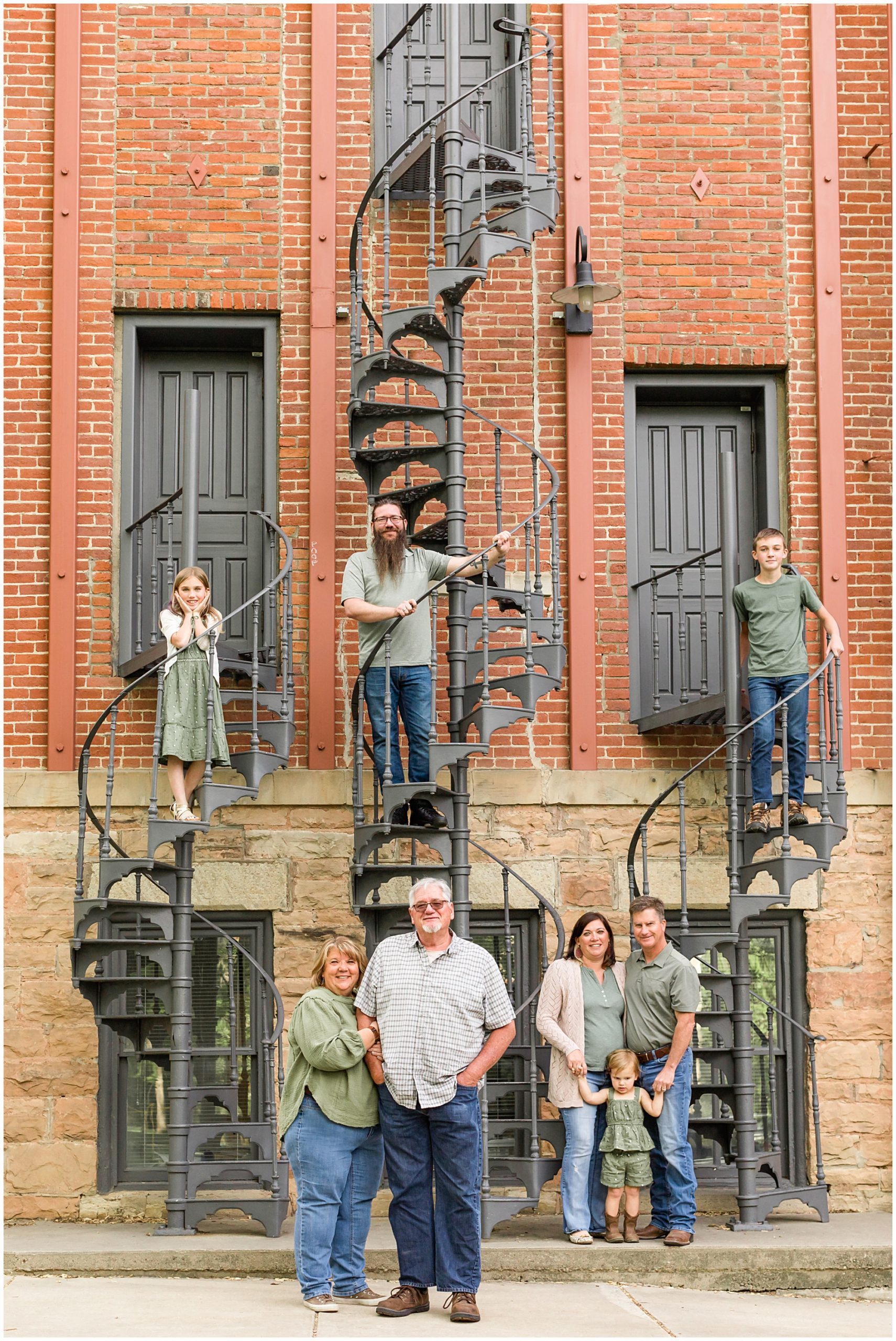 An extended family smile at the camera during an extended family session in Boulder