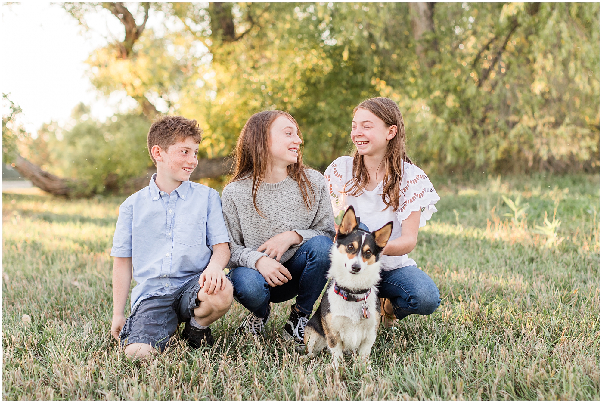Two sisters pose with their brother and corgi during a mini session at Thomas Reservoir
