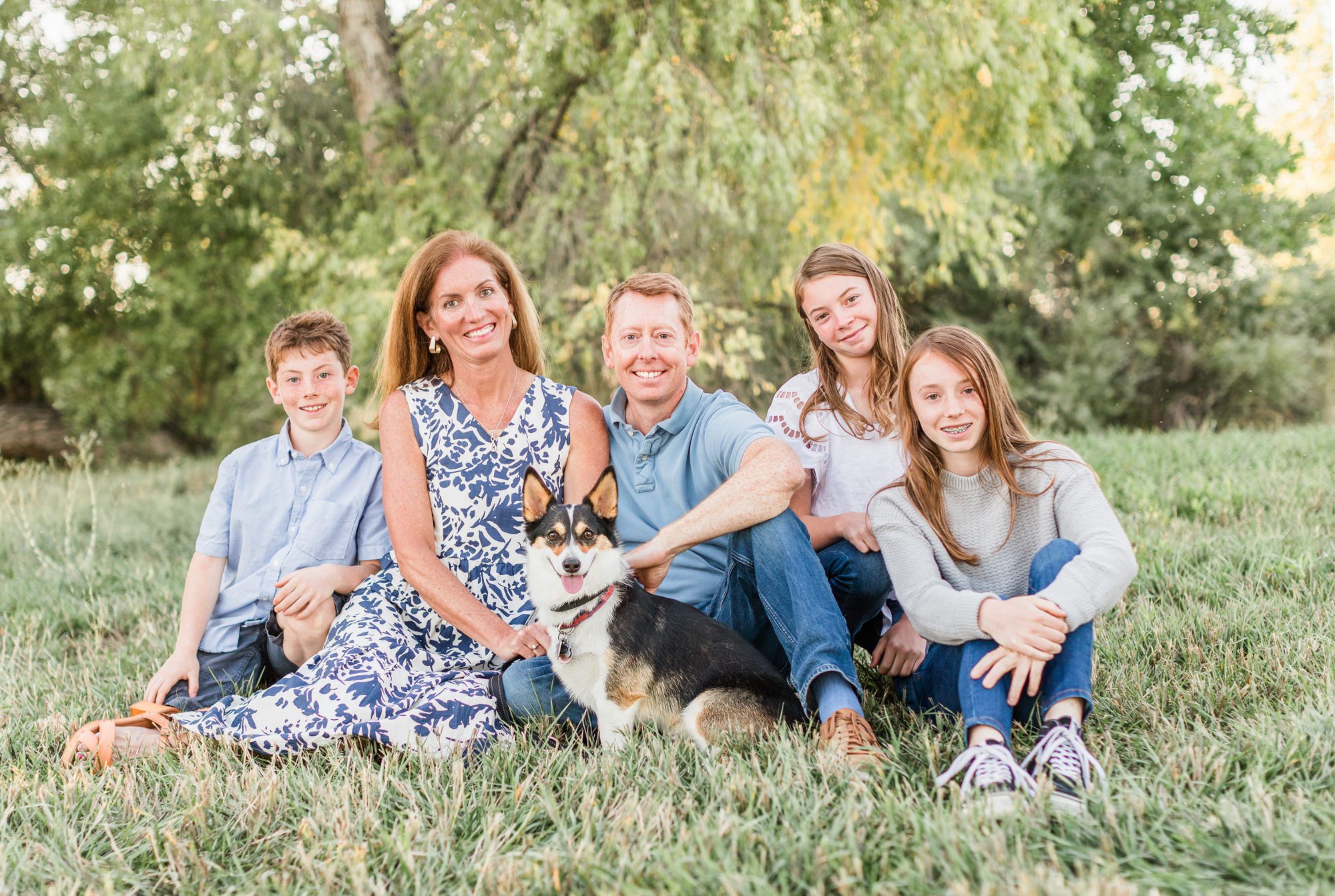 A family of five pose with their pet corgi during a fall mini session at Thomas Reservoir