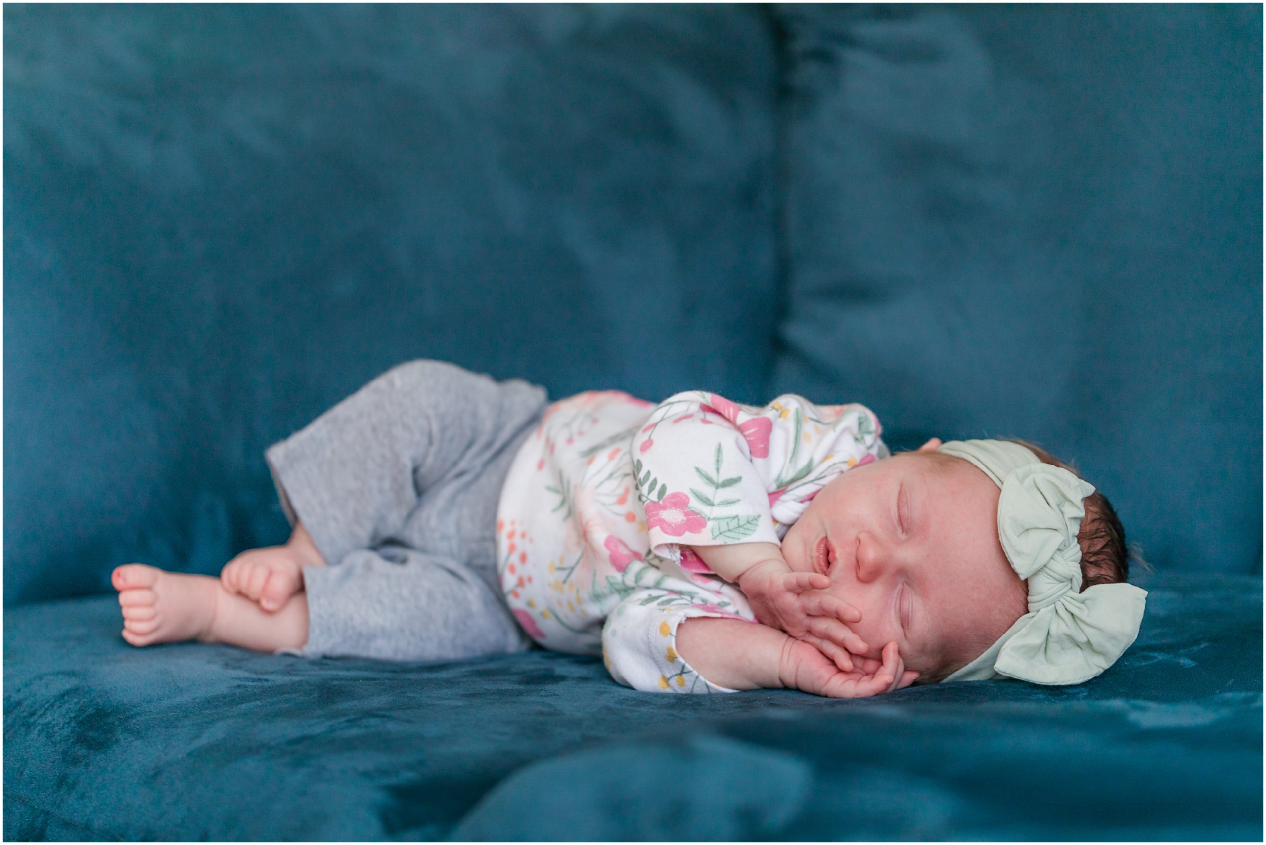 A photo of a baby girl sleeping on a sofa taken during an in-home newborn session by Theresa Pelser Photography