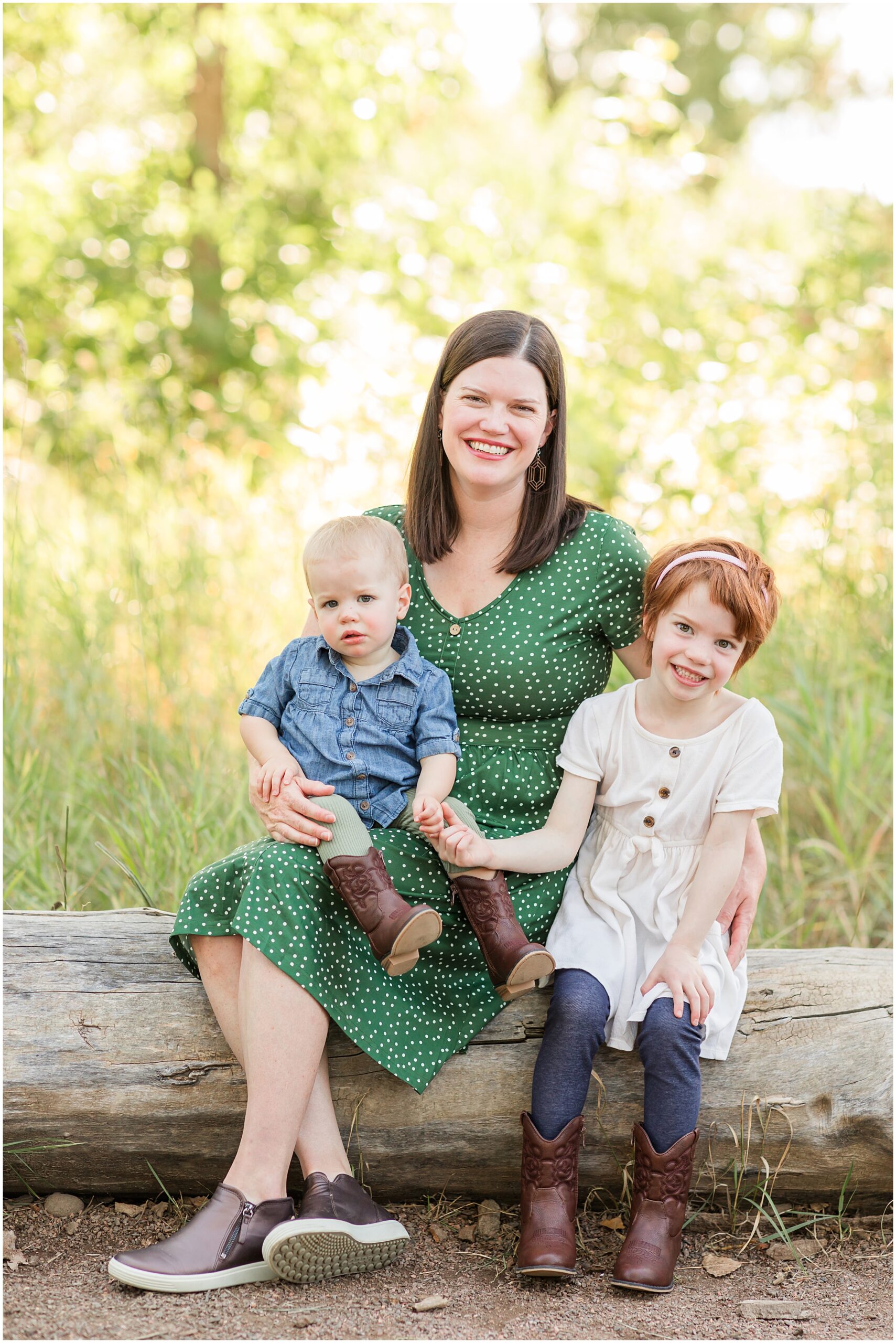 Mother hugging children in a joyful moment, captured in a mini family session by Theresa Pelser Photography