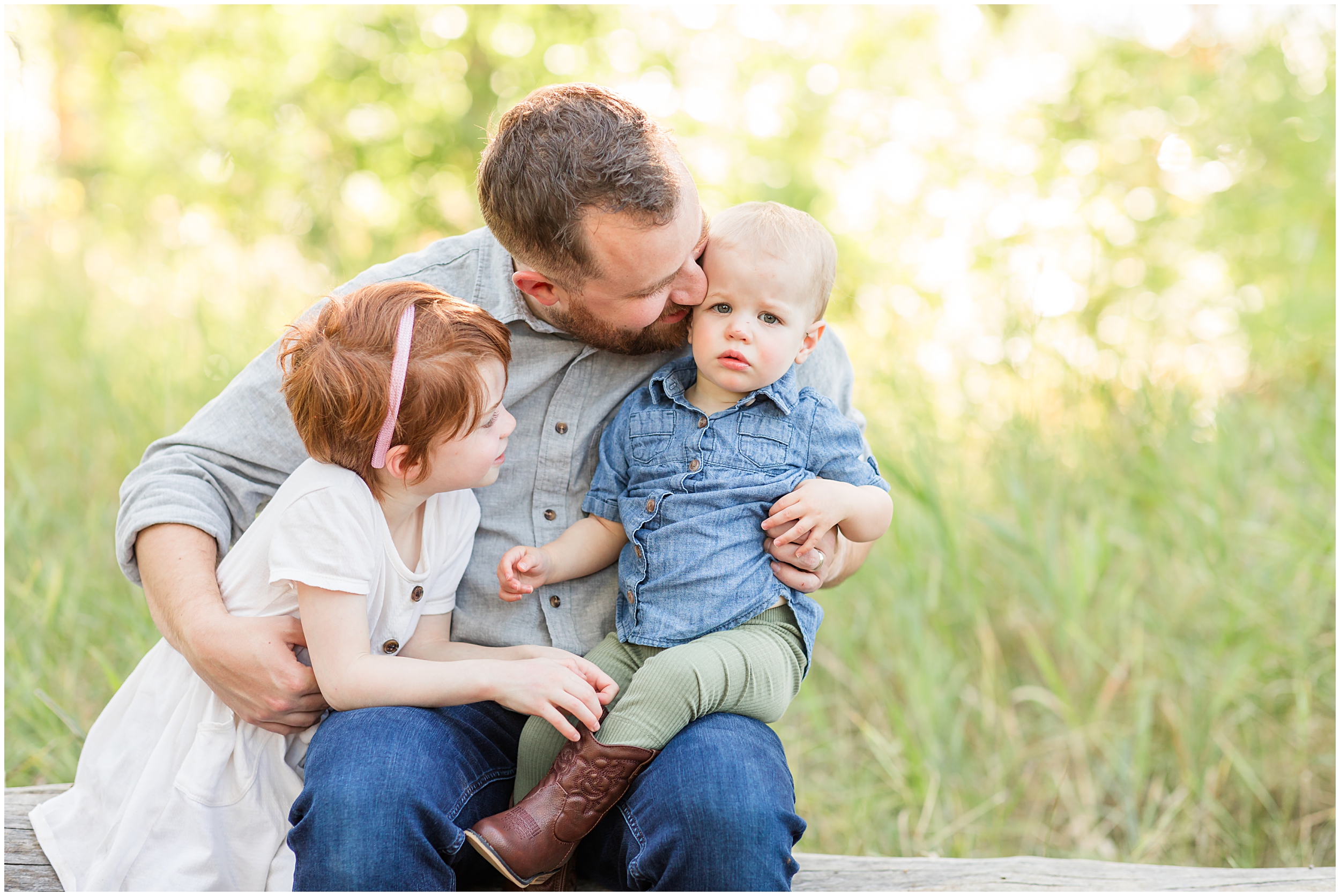 Father hugging children in a joyful moment, captured in a mini family session by Theresa Pelser Photography