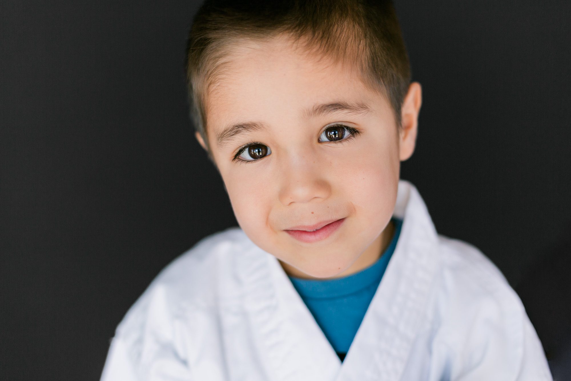 Schilz Martial Arts picture day portrait of a young student at Schilz Martial Arts in Lafayette, Colorado taken by Theresa Pelser Photography