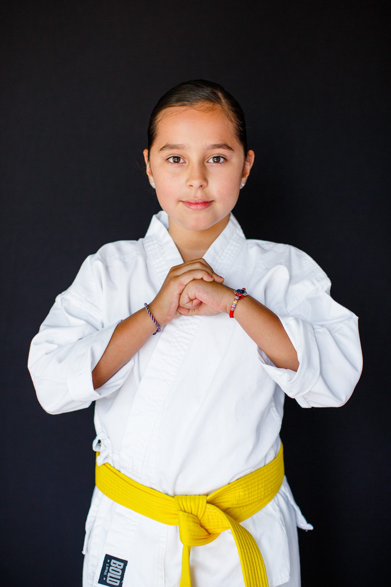 Portrait of a yellow belt martial arts student taken on picture day at Schilz Martial Arts by Theresa Pelser Photography