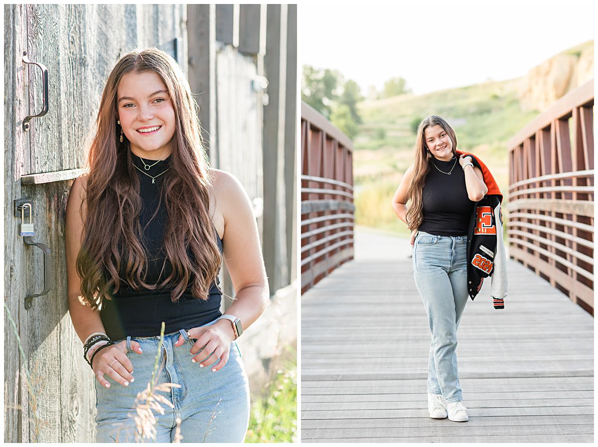 Senior portraits of a girl carrying a letterman jacket and jeans, walking across a bridge, and leaning against an old barn, at Sandstone Ranch.